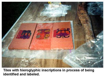 Tiles with hieroglyphic inscriptions in process of being identified and labeled. Tiles with hieroglyphic inscriptions in process of being identified and labeled.