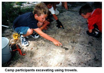 Camp participants excavating using trowels. Camp participants excavating using trowels.