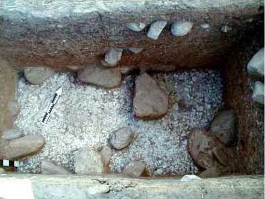 Figure 14. Plaster floor in test pit Op1, at a depth of about 1.6 m below surface.