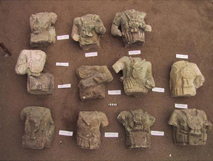 Figure 18. Maize god busts in sand box at CRIA. (Author photo.)