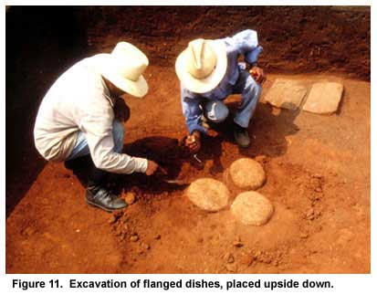 Figure 11. Excavation of flanged dishes, placed upside down. Figure 11. Excavation of flanged dishes, placed upside down.