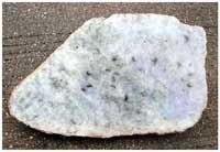 Figure 3. Purple jadeite from R&iacute;o Hondo area (length of slab, 22 cm.).