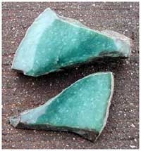 Figure 4. Polished jadeite from El Cipr&eacute;s, R&iacute;o Blanco region (length of larger piece at top, 12 cm.).