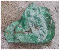 Figure 12. Alluvial jade boulder from Motagua River between Mixco Viejo and modern town of El Chol (length, 35 cm.).
