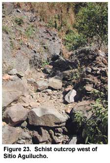 Figure 23. Schist outcrop west of Sitio Aguilucho. Many of the schist blocks covering the platforms at Sitio Aguilucho were probably obtained from this nearby source. Figure 23. Schist outcrop west of Sitio Aguilucho. Many of the schist blocks covering the platforms at Sitio Aguilucho were probably obtained from this nearby source.