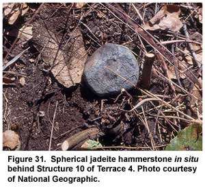 Figure 31. Spherical jadeite hammerstone in situ behind Structure 10 of Terrace 4. Photo courtesy of National Geographic. Figure 31. Spherical jadeite hammerstone in situ behind Structure 10 of Terrace 4. Photo courtesy of National Geographic.