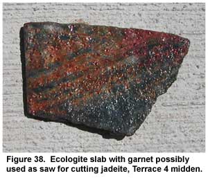 Figure 38. Ecologite slab with garnet possibly used as saw for cutting jadeite, Terrace 4 midden. Figure 38. Ecologite slab with garnet possibly used as saw for cutting jadeite, Terrace 4 midden.