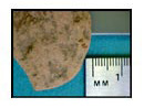 Figure 33e. Wear on large spall.