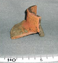 Figure 34f. Extensively discolored potstand with baked-on clay, made on recycled jar, PVN 202 (Las Canoas).