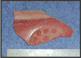 Figure 36l. Impressed medallion on Cuchillo incised.
