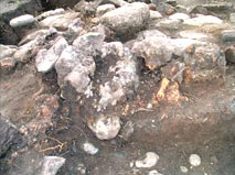 Figure 44a. Furnace for copper smelting: El Coyote, Str. 372, Furnace in situ, north to right.