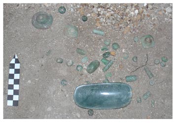 Figure 34. Greenstone beads forming necklaces, pectoral and ear-spools found in the tomb.