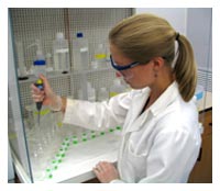 Figure 16. Loading samples into cation exchange columns packed with strontium resin.