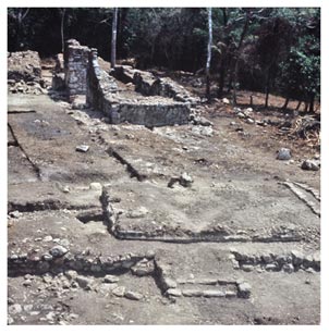 Figure 3. Ruins of the two Spanish churches. The stone chancel-chapel of YDL II is in the background. In the foreground is the central part of YDL I. Visible are the south stair of YDL I, the razed Tulum-style temple over which YDL I was built; and to the right, the steps leading up to the altar/sanctuary. The photo looks north-northeast.