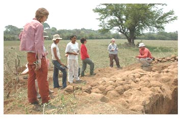 Figure 1. Professor Amador instructs students from Georgia State University and from the National University of El Salvador on the importance of architectural documentation and condition assessment studies.