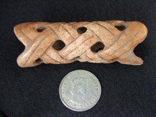 Figure 8. Carved bone with woven mat motif, with Burial 58.