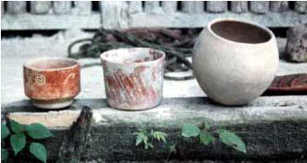 Figure 10. Different styles of ceramics brought back by the chicleros from the jungle. They are now in exhibition to the public. (Dos Lagunas Biotope and Uaxact&uacute;n Collections.)