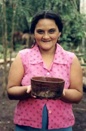 Figure 11. Felicita Barrera, a cook from La Toronja camp, with the bowl she uses to contain tortillas.