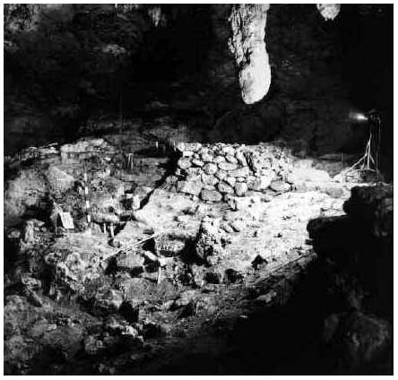 Figure 1: Dry-laid masonry retaining wall with plastered platform surface. Entrance chamber, Las Cuevas, Belize