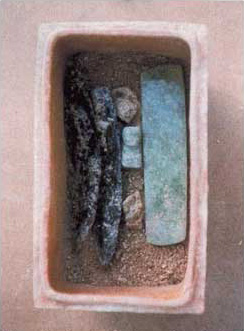 Figure 15. Contents of ceramic cache box, in situ, from Structure A1 excavations.