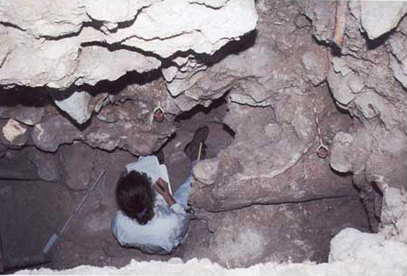 Figure 16. Basal part of stucco figure undergoing excavation in Structure A1 excavations.