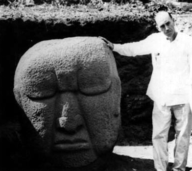 Edwin M. Shook standing next to one of the Monte Alto sculptures.