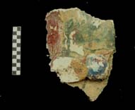Figure 3:18 - A bead with an attachment on a curvilinear band. The paint on this piece, from LA 1103, matches the band shown in Figure 3:98 from LA 1289.