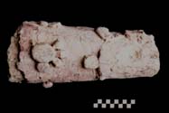 Figure 3:27 - This is a larger than life size representation of a leg, and probably belonged to the central figure based on its elaborate decoration. Figure 3:27 - This is a larger than life size representation of a leg, and probably belonged to the central figure based on its elaborate decoration.