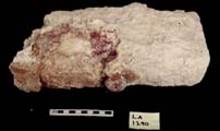 Figure 3:49 - Stone armature with adornos and panel. This piece may have functioned as part of the upper zone molding. Figure 3:49 - Stone armature with adornos and panel. This piece may have functioned as part of the upper zone molding.