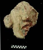 Figure 3:99 - Detail of the face from Figure 3:98. The face was raised from the fa&ccedil;ade surface, and details, such as the earflare, were painted for highlight.