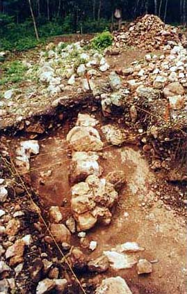 Figure 3b. Photo looking west of horizontal exposure showing the Substructure's exterior walls and stucco floor surfaces.
