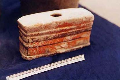 Figure 4c. Photo of a Mayanized rending of a Teotihuac&aacute;n-style single-hole candelero with black and brown-on-orange decoration showing a slightly battered upper fa&ccedil;ade, a three-part cornice molding, and sloping lower walls with a projecting basal molding. This unique piece was completely stucco coated and shows evidence of burning on the inside directly beneath the hole opening.